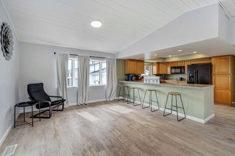 Bright and airy space with vaulted ceilings, large windows, and easy access to the outdoor deck—perfect for seamless indoor-outdoor living.