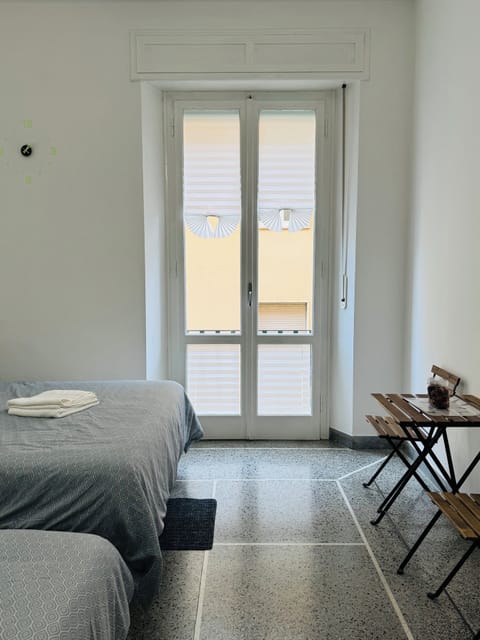 Classic Quadruple Room, City View | Desk, laptop workspace, free WiFi