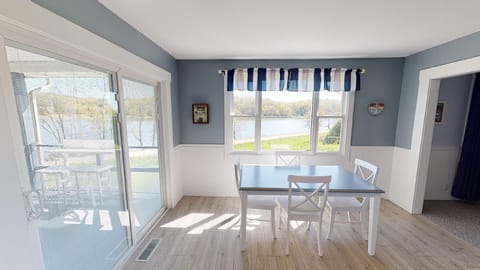 The kitchen offers stunning views of the serene lake.