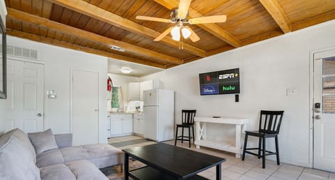Netflix, ESPN, and a couch that moonlights as a bed-nap game strong in this living room!