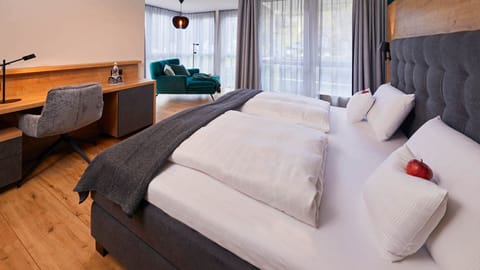 Deluxe Double Room, Balcony, Garden View | In-room safe, blackout drapes, free WiFi, bed sheets