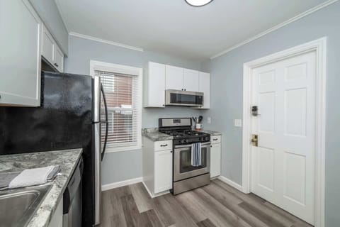 The sleek kitchen offers ample space & all the comforts of home