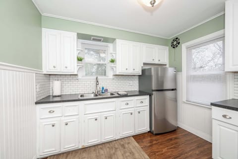 The serene kitchen is well equipped with everything needed for a great stay