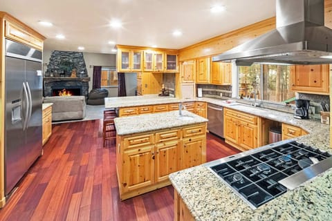 Beautiful modern open eat in kitchen. With huge refrigerator and stainless steel appliances. Ready for your mountain feast.