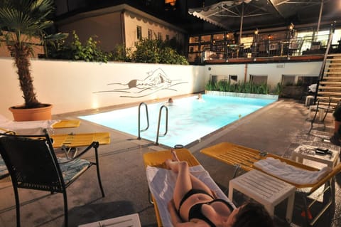 Seasonal outdoor pool, open 10:00 AM to 9:00 PM, sun loungers