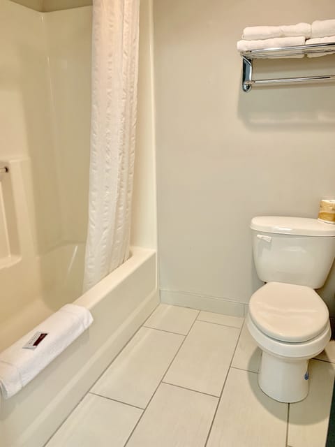 Suite, 2 Queen Beds | Bathroom | Combined shower/tub, free toiletries, hair dryer, towels