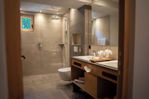 Shower, hair dryer, slippers, towels