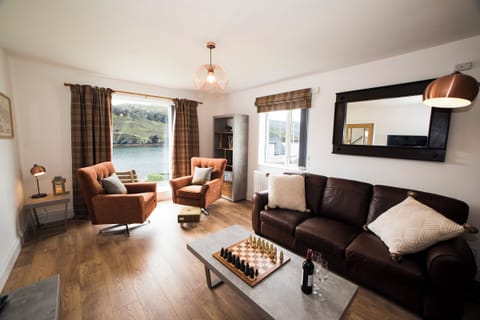 Living Room with a view over West Loch and a Real Flame Fire to cosy up to.