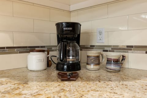 Of course there is coffee! A drip machine to save K Cups.