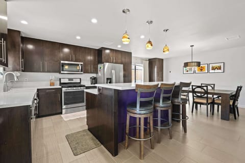 Elegant coastal kitchen with ample space and amenities galore