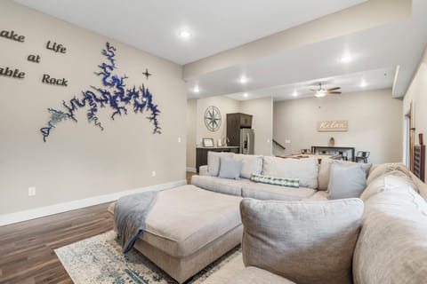 Downstairs Recreation Room Features a Kitchenette, Additional Dining Space, a Lovely Seating Area with Cable TV and a Fireplace, Pool Table, a Multi-Game Arcade Machine, and Access to the Lower Deck!