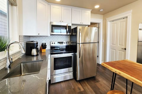 Clean and bright kitchen with modern appliances.