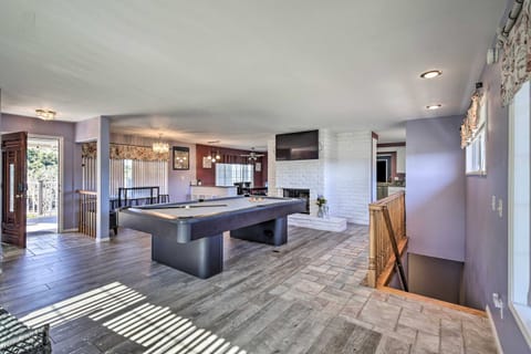 Spacious, stylish, and fully equipped for comfort! This open-concept living room invites you to relax with plush seating, a large TV, and seamless indoor-outdoor flow. Perfect for making unforgettable memories!