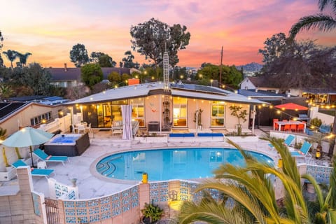 Backyard oasis with BBQ grill, pool and hot tub with a stunning city views