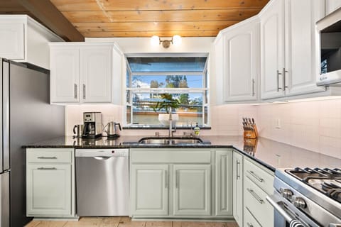 This kitchen offers a functional layout and all the essentials for cooking