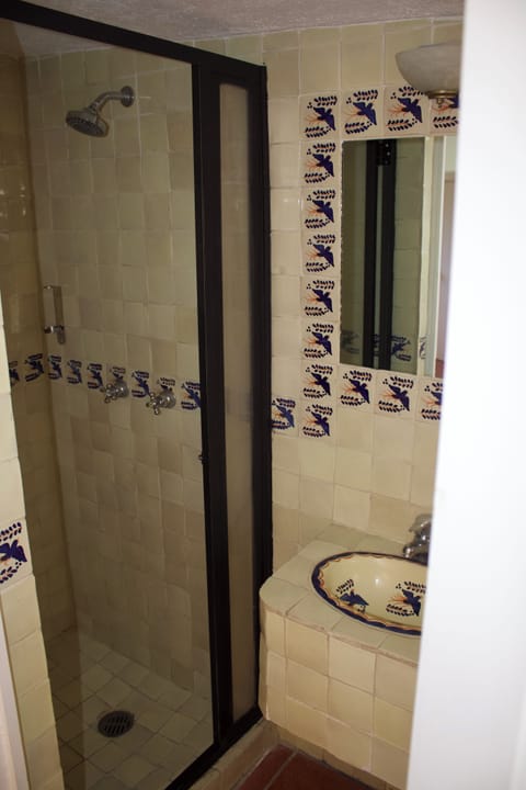 Shower, free toiletries, towels, toilet paper