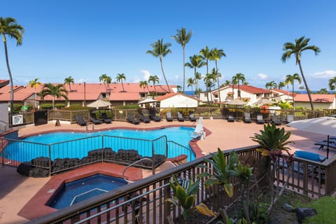First of two pool areas with jacuzzi, dining area, ocean views