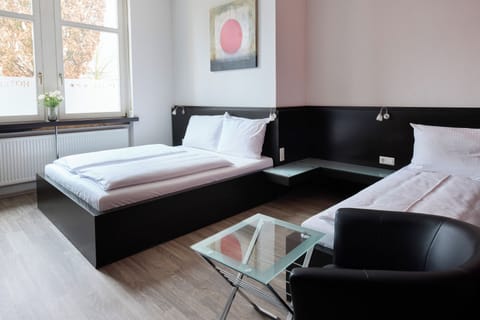 Classic Triple Room | Desk, laptop workspace, blackout drapes, free WiFi