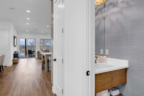 Half bathroom found in the hallway near the kitchen