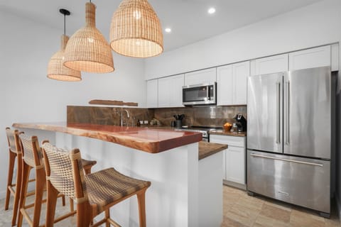 Electric stove, oven, fridge, dishwasher, microwave, and water purifier.