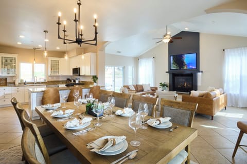Open concept living room, dining room and kitchen. Dining table seats 8.