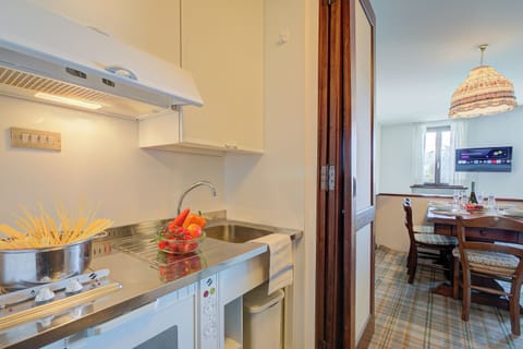 Family Apartment, 2 Bedrooms (Appartamento Principino 24 Ski in Ski) | Private kitchen | Fridge, oven, stovetop, dishwasher