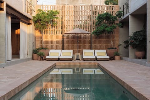 Outdoor pool, open 9:00 AM to 11:00 PM, pool umbrellas, sun loungers