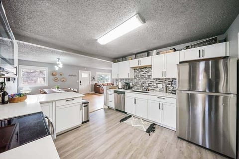 The kitchen is fully stocked with a blender, coffee maker, french press maker, coffee grinder, pots, pans, and cooking utensils to make your meal-prep as easy as pie.