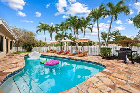 Pool with sun loungers and inflatables