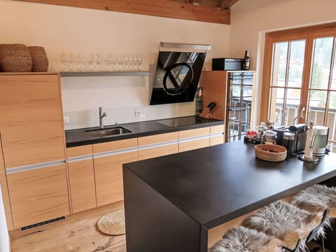 Furniture, Flooring, Kitchen, Countertop, Interior Design, Wood, Cabinetry, Kitchen Appliance, Floor, Home Appliance