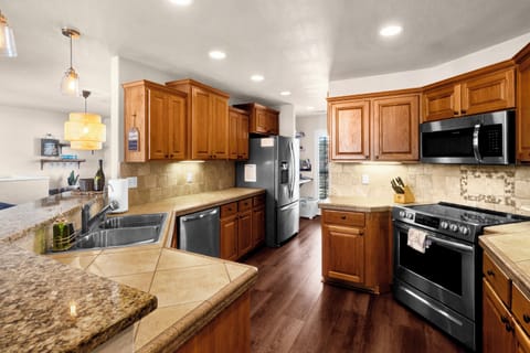 Open living, dining and kitchen area. Fully stocked kitchen.