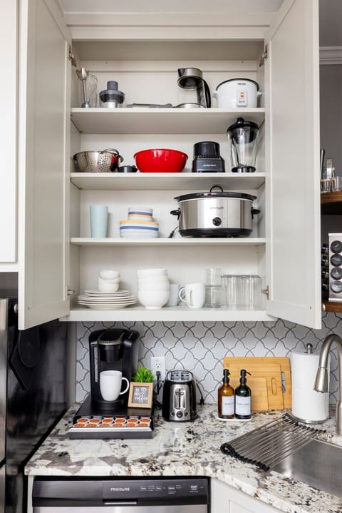 Cook, dine, and unwind! This fully stocked kitchen boasts a Keurig coffee maker, ample cabinets, and a modern sink — ideal for extended stays and family vacations.