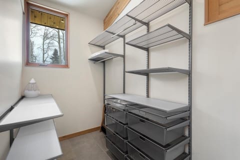 This huge walk in closet in the primary suite allows storage for all your items.