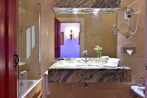 Bathtub, eco-friendly toiletries, hair dryer, bidet