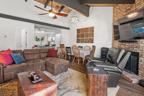 Cozy fireplace and big screen TV with Roku.