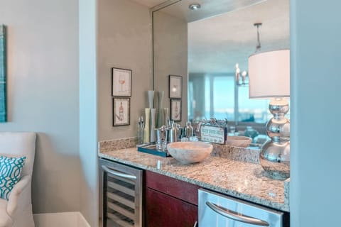 Perfect for entertaining, this dining area features a convenient wet bar with a wine cooler and blender. Create memorable gatherings in this stylish and functional space.
