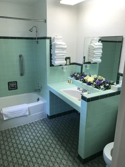 Deluxe Room, 2 Queen Beds | Bathroom | Shower, free toiletries, towels