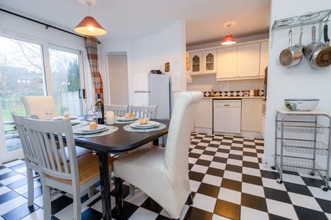 Aughrim Holiday Village No. 14. Aughrim holiday village. Dining table, six chairs. Open plan kitchen.