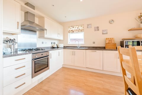 Benasa Lodge, Newquay. Ground floor: The well-equipped kitchen comes complete with an electric oven and gas hob, fridge/freezer, microwave, dishwasher, and washer/dryer