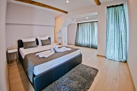 Panoramic Apartment, Sea View | Minibar, blackout drapes, iron/ironing board, free WiFi