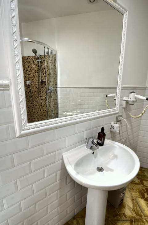 Superior Quadruple Room, City View | Bathroom | Shower, hair dryer, towels, soap