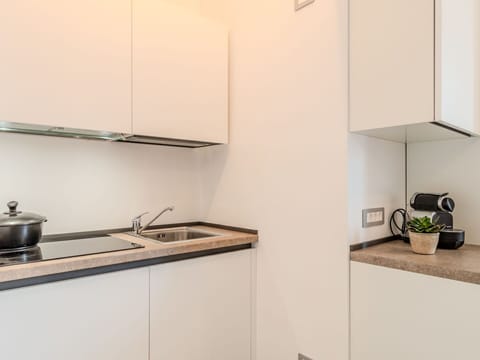 Countertop, Kitchen, Interior Design, Kitchen Appliance, Cabinetry, Wood, Flooring, Furniture, Major Appliance, Room