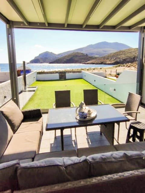 Outdoor Dining & Lounge Area – Enjoy al fresco meals with stunning sea and garden views.