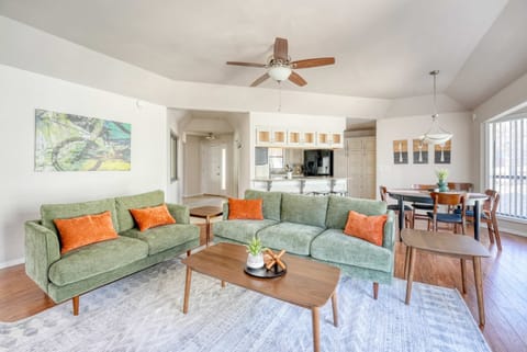 Spacious living room with vibrant decor, open layout, & plenty of seating—ideal for game nights and family bonding.
