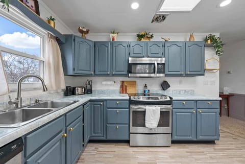 The updated eat-in kitchen offers ample space & every home comfort