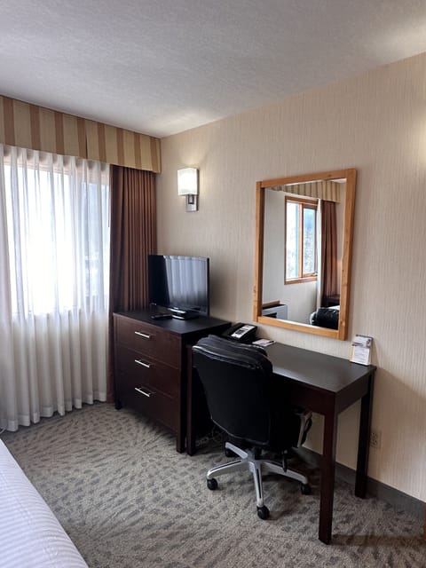 Deluxe Suite | Premium bedding, desk, laptop workspace, blackout drapes