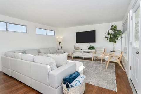 Bright, modern living room with plush seating and a relaxed coastal feel
