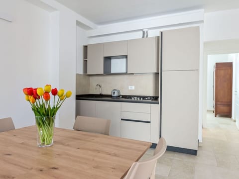 Furniture, Interior Design, Flooring, Wood, Countertop, Floor, Kitchen, Room, Table, Cabinetry