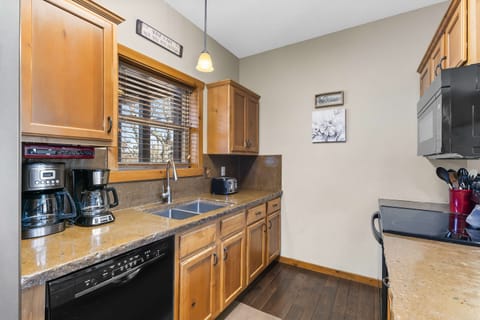 The inviting kitchen offers ample storage & every home comfort