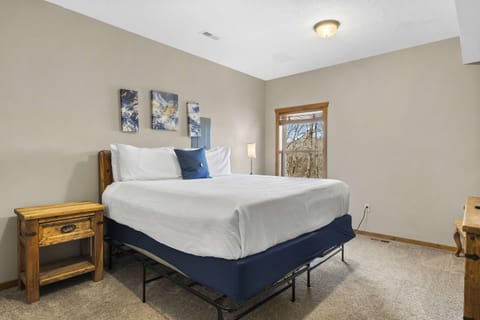 A plush king bed, smart TV, & ensuite await in the final bedroom retreat